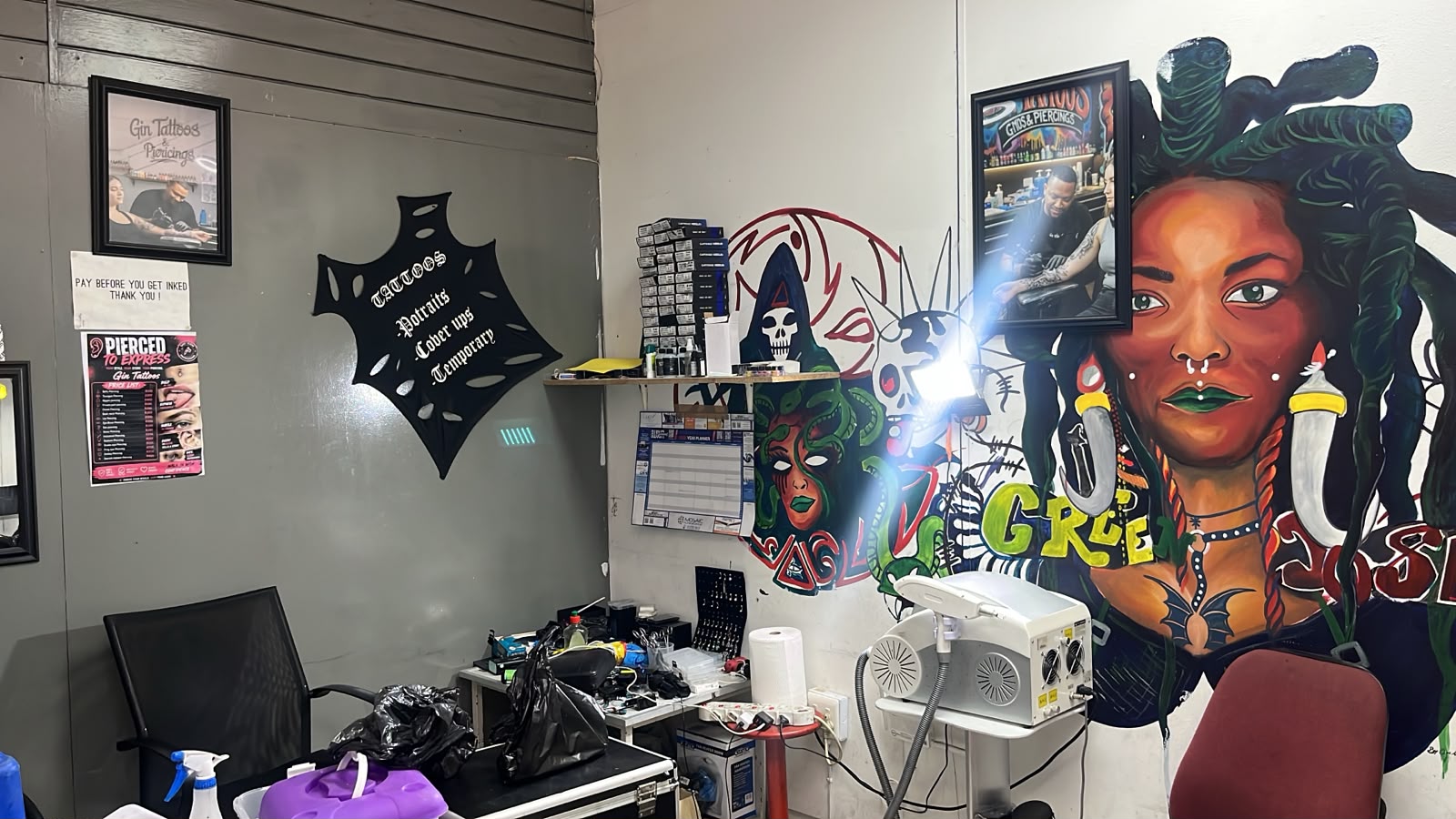 Tattoo artist working inside Gin Tattoos studio in Brits